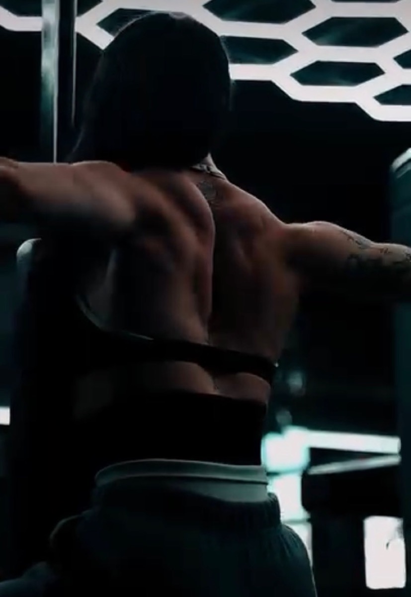 K Hastings training back in a dark gym setting